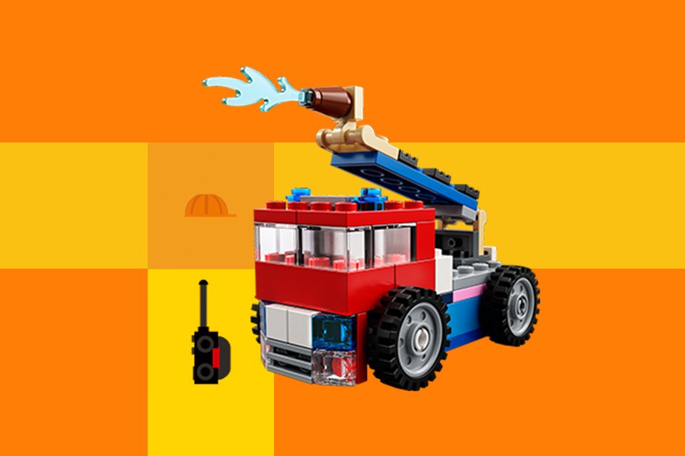 A LEGO® fire engine build against yellow background.